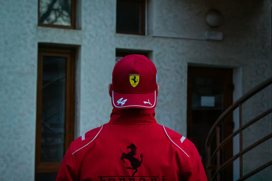 Man wearing a red ferrari hat and jacket